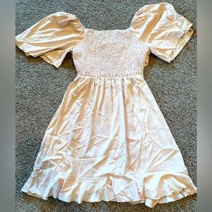 Women’s size medium, cream colored smocked dress